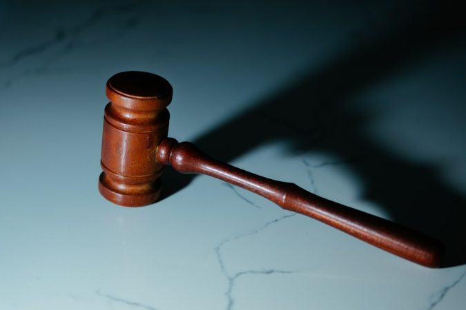 wooden gavel on a marble surface