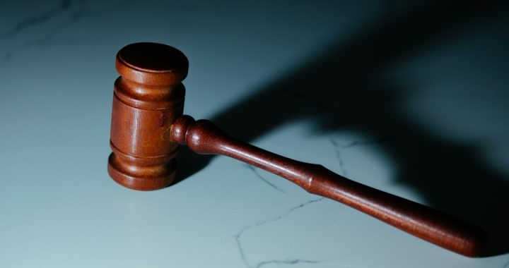 wooden gavel on a marble surface