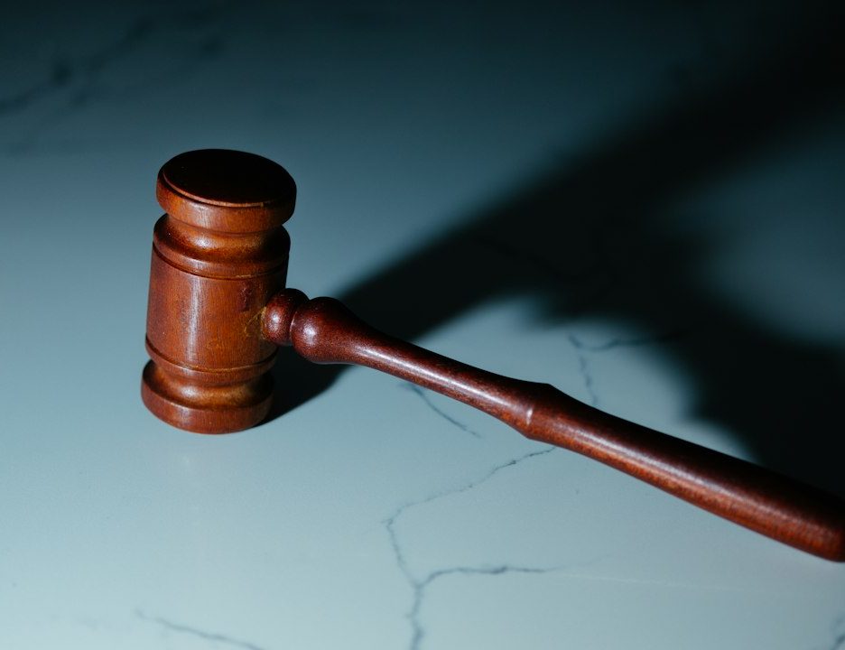 wooden gavel on a marble surface